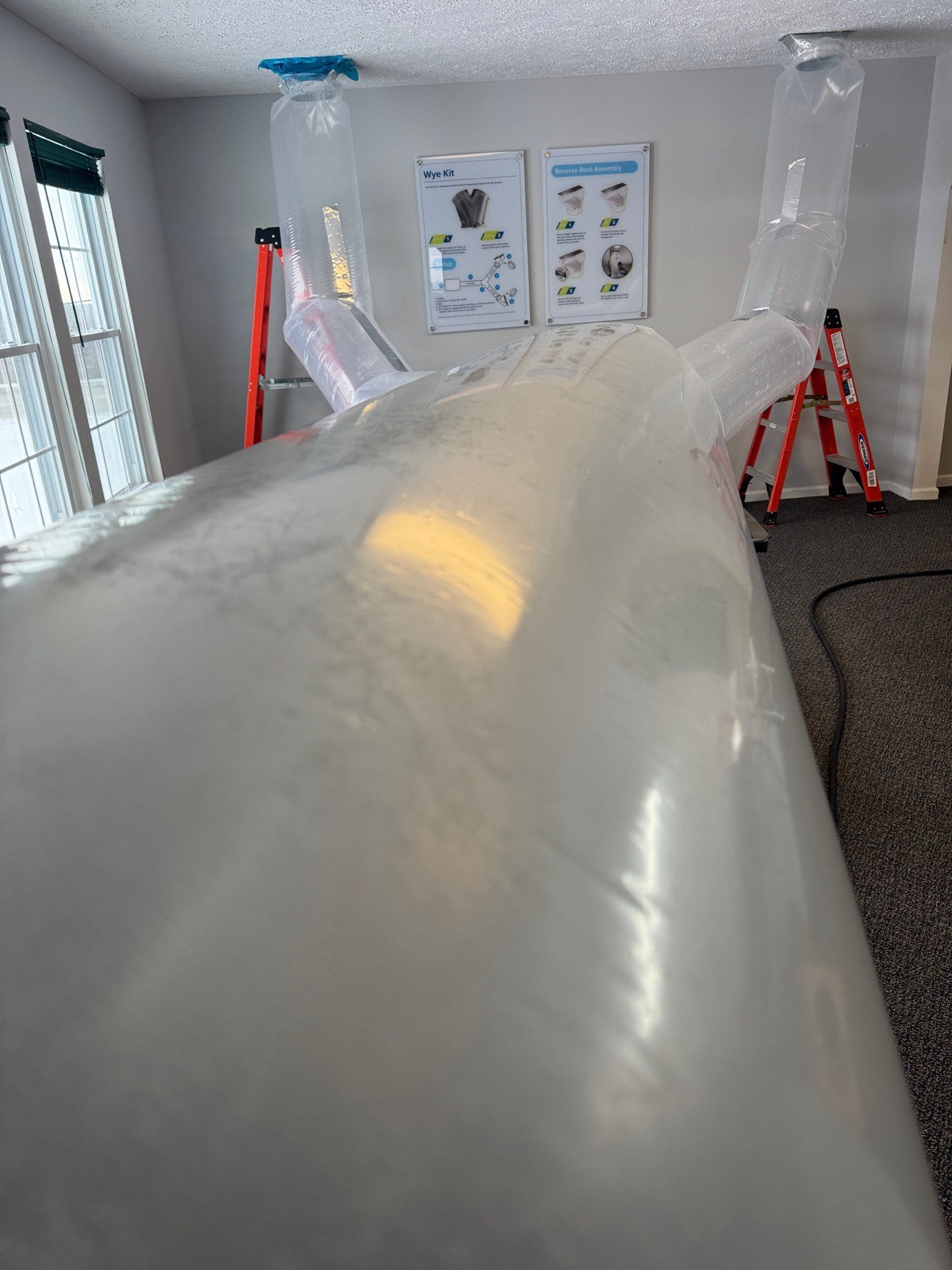 Daffy Ducts Aeroseal inflated duct sealing bag during an Atlanta duct sealing job