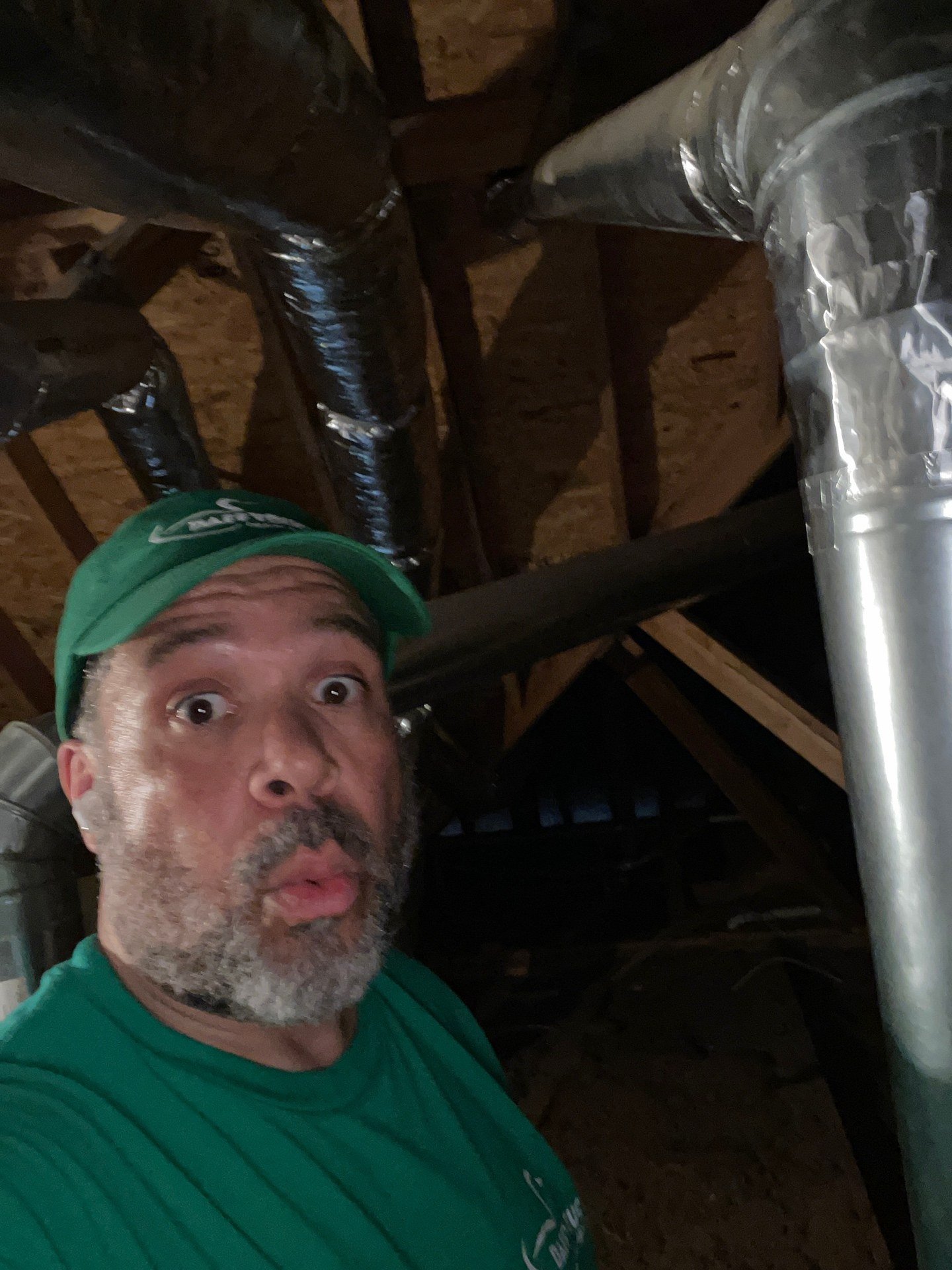 Daffy Ducts technician inspecting attic ductwork for an AC not cooling house Atlanta problem